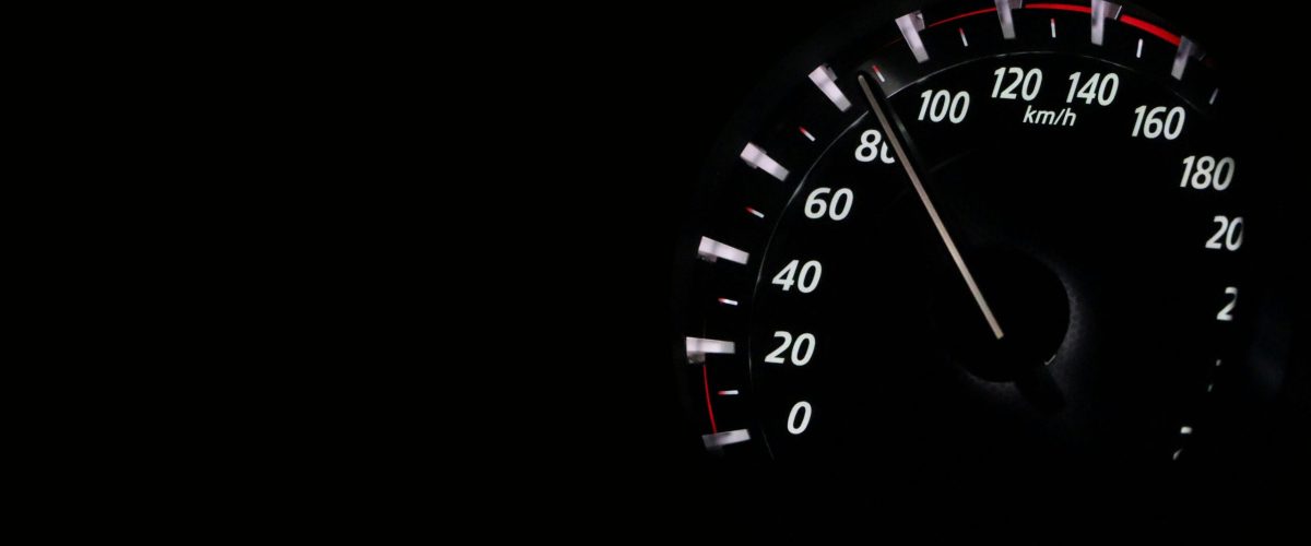 pexels-photo-248747-248747 Speedometer reading showing speed in km/h on a dark background.